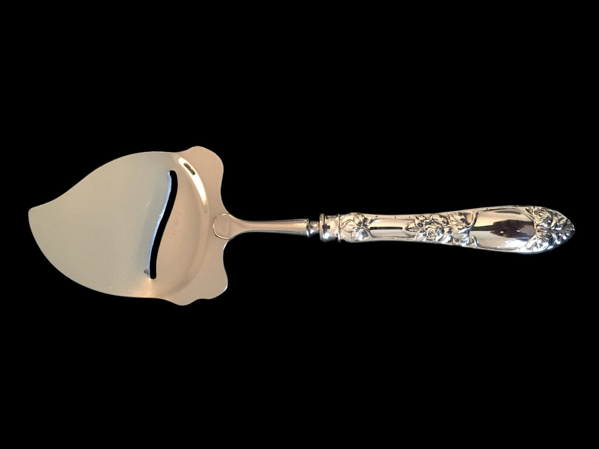 Opphøid Rose sølv ostehøvel buet modell 22.5 cm