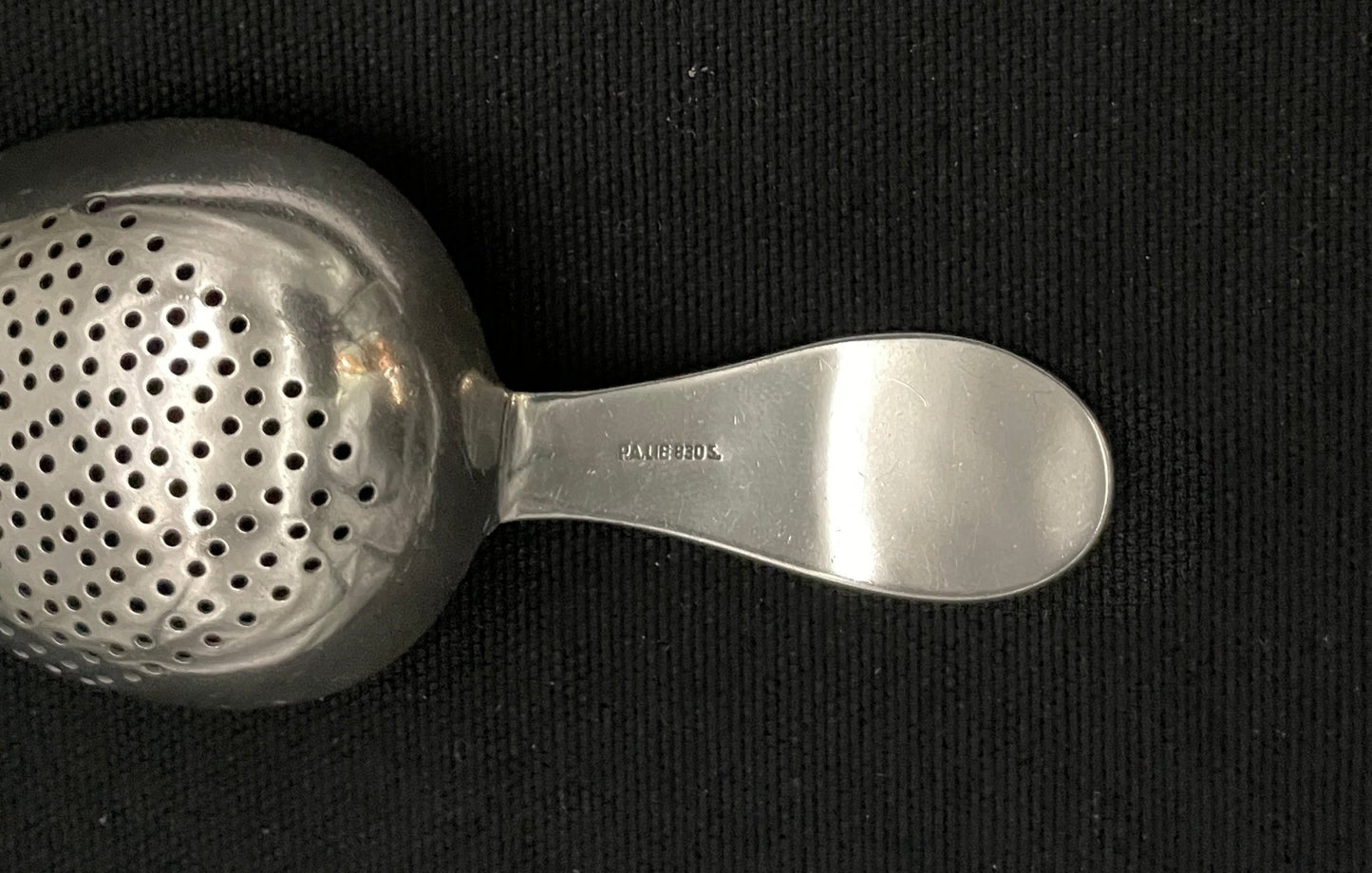 Hammered Skjell silver tea strainer in the 830s by Tostrup and PA Lie