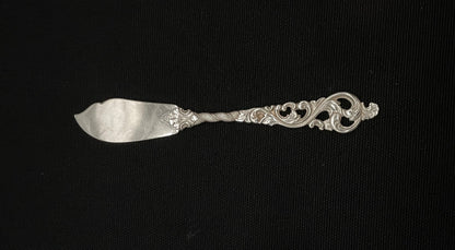 Double Rococo silver butter shovel and other parts in the 830s by Brødrene Lohne