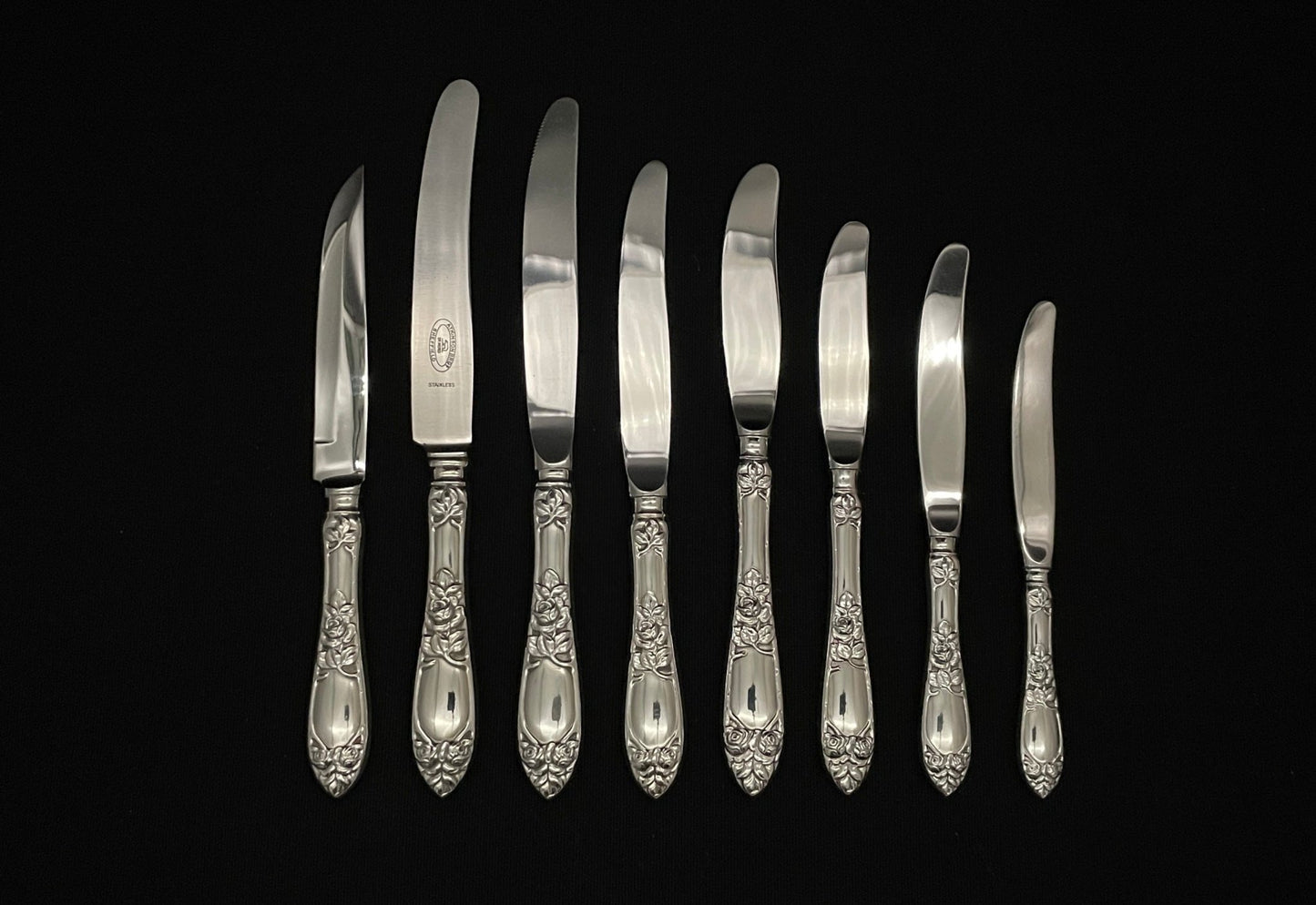 Raised Rose silver knives in new and older models in 830 silver