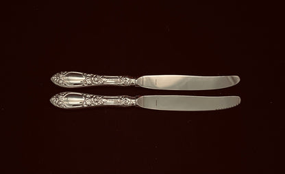 Raised Rose silver knives in new and older models in 830 silver