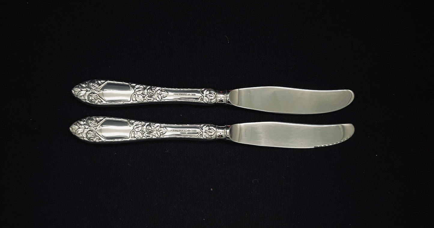 Raised Rose silver knives in new and older models in 830 silver