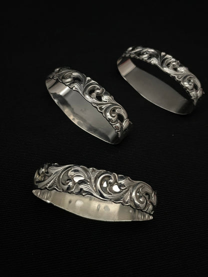 Tele silverware napkin rings in 830s by the Mylius Brothers.