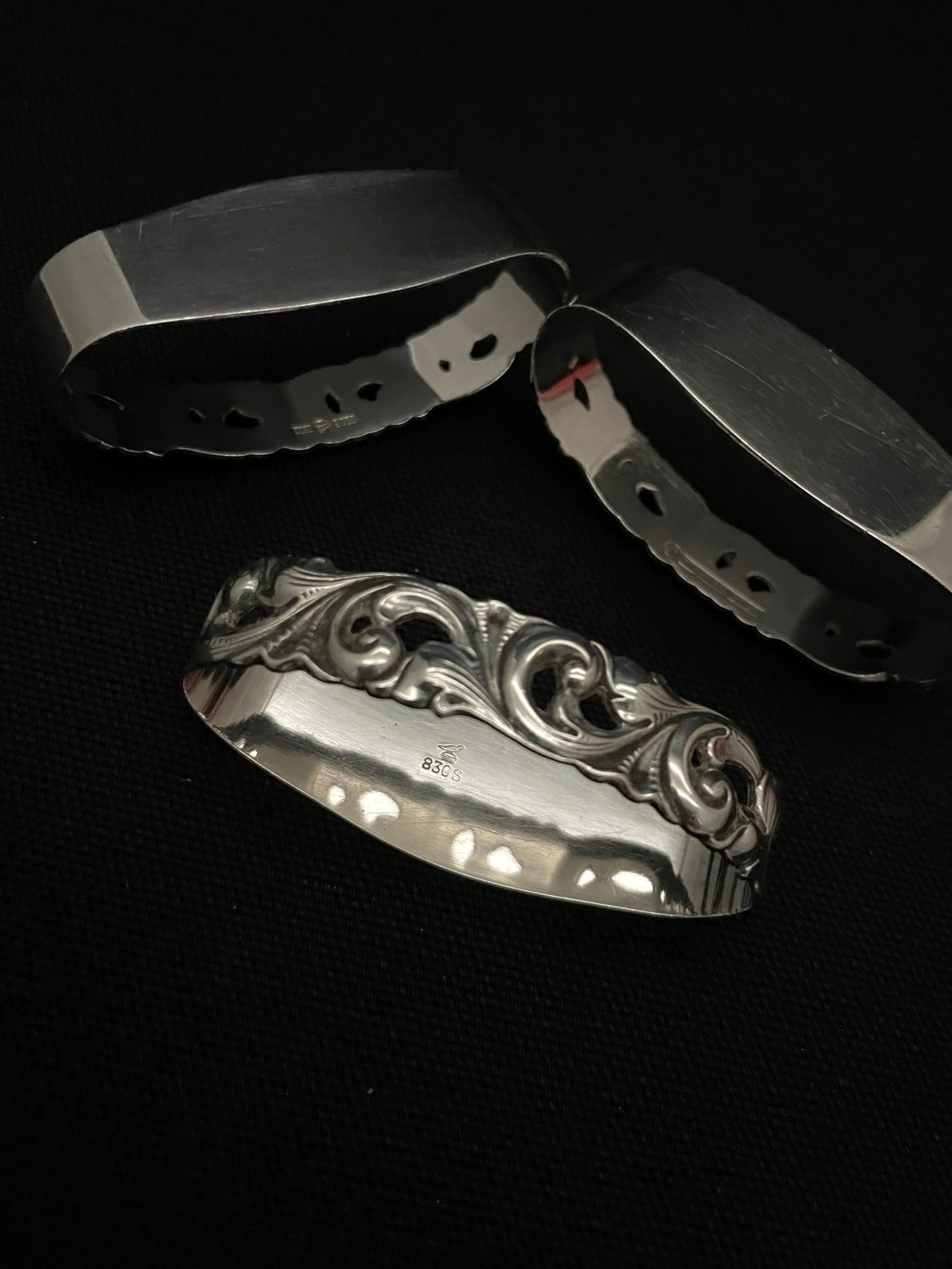 Tele silverware napkin rings in 830s by the Mylius Brothers.